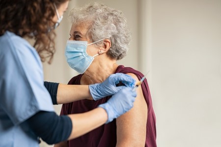 Fifth of care home residents in England awaiting first Covid jab
